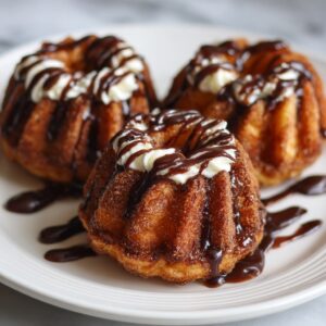 Mini Churro Bundt Cakes with Chocolate Drizzle